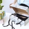 Image of mailer box with black ribbons